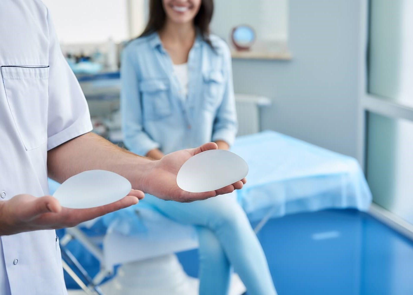 Surgeon holding silicone impla